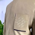 Beige with a celtic knot pocket design